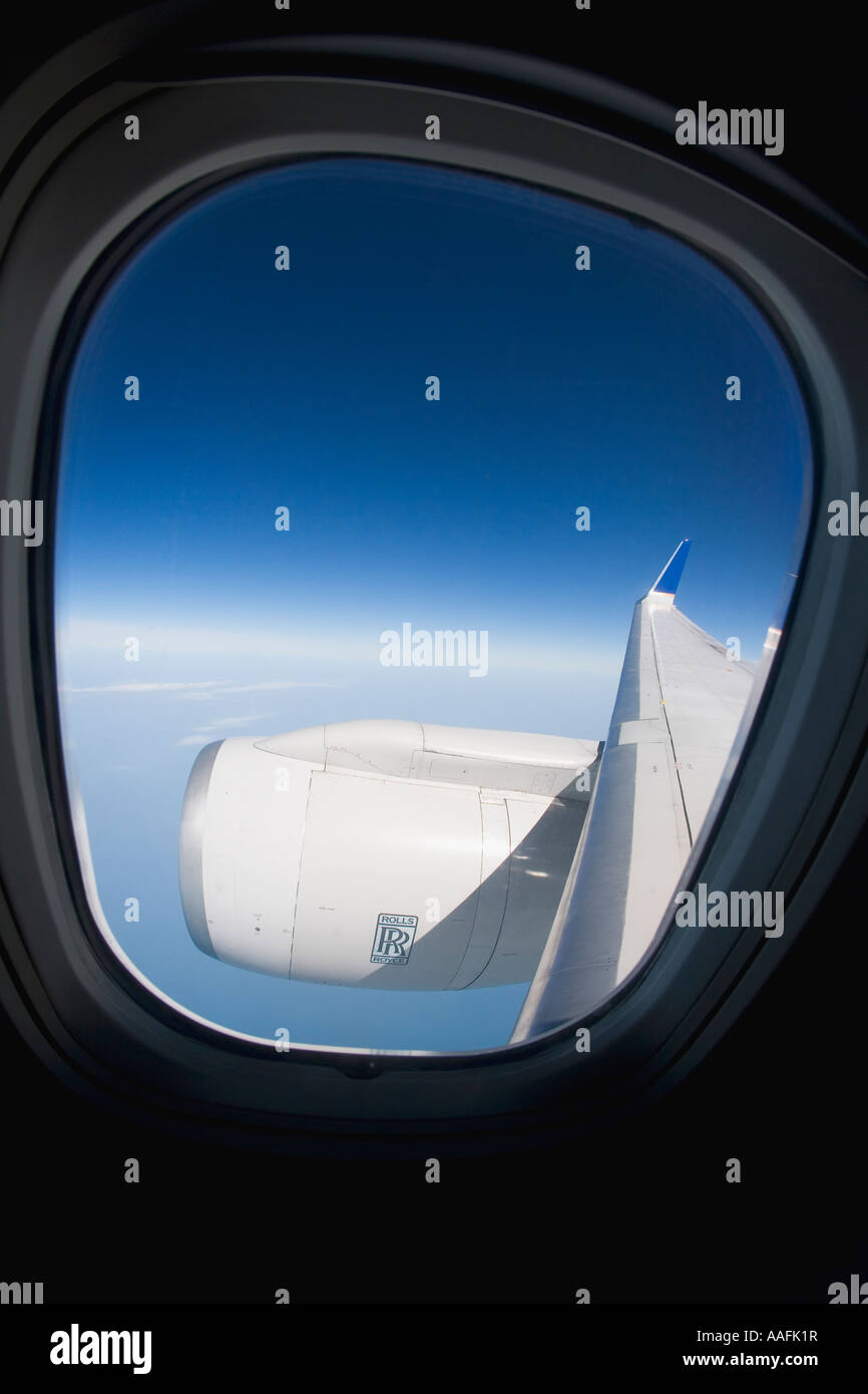 Rolls Royce aero engine sul volo transatlantico jet con passeggero aereo aereo finestra Piano di sole prese a 33000 ft Foto Stock