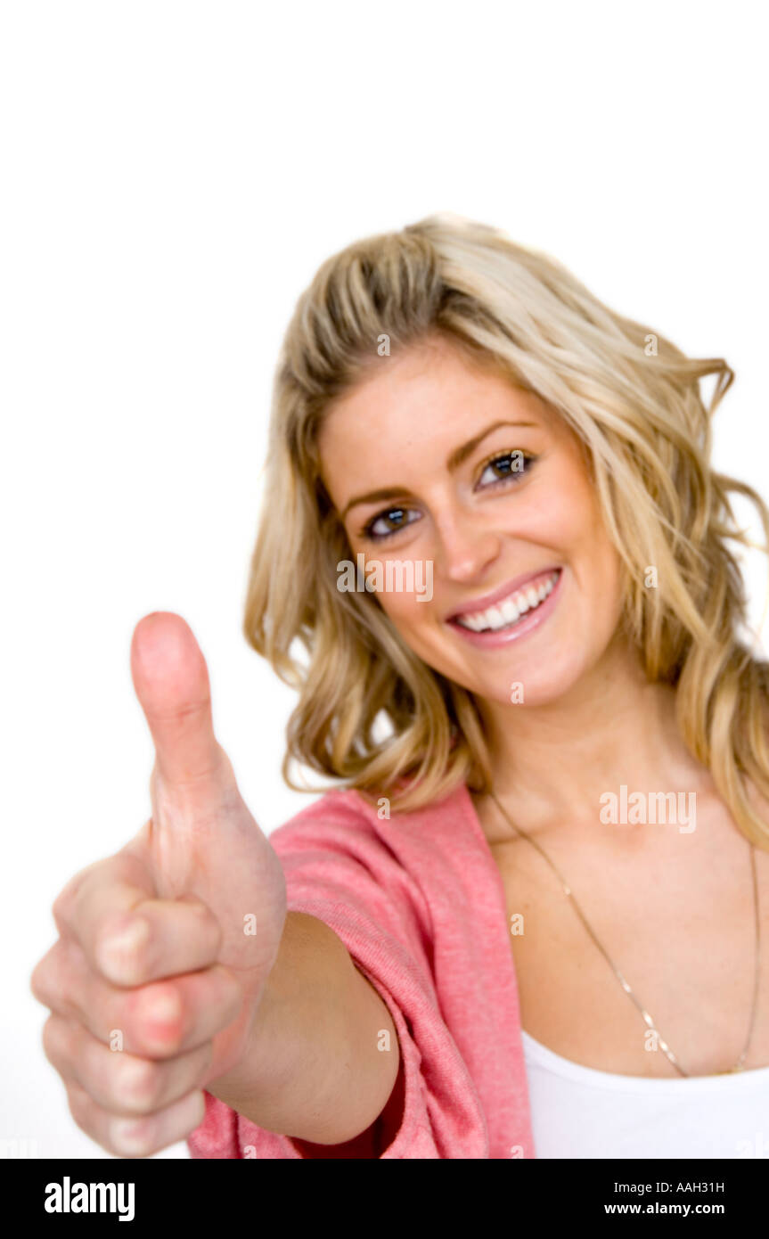 Donna che un pollice in alto gesto segnale a mano Foto Stock