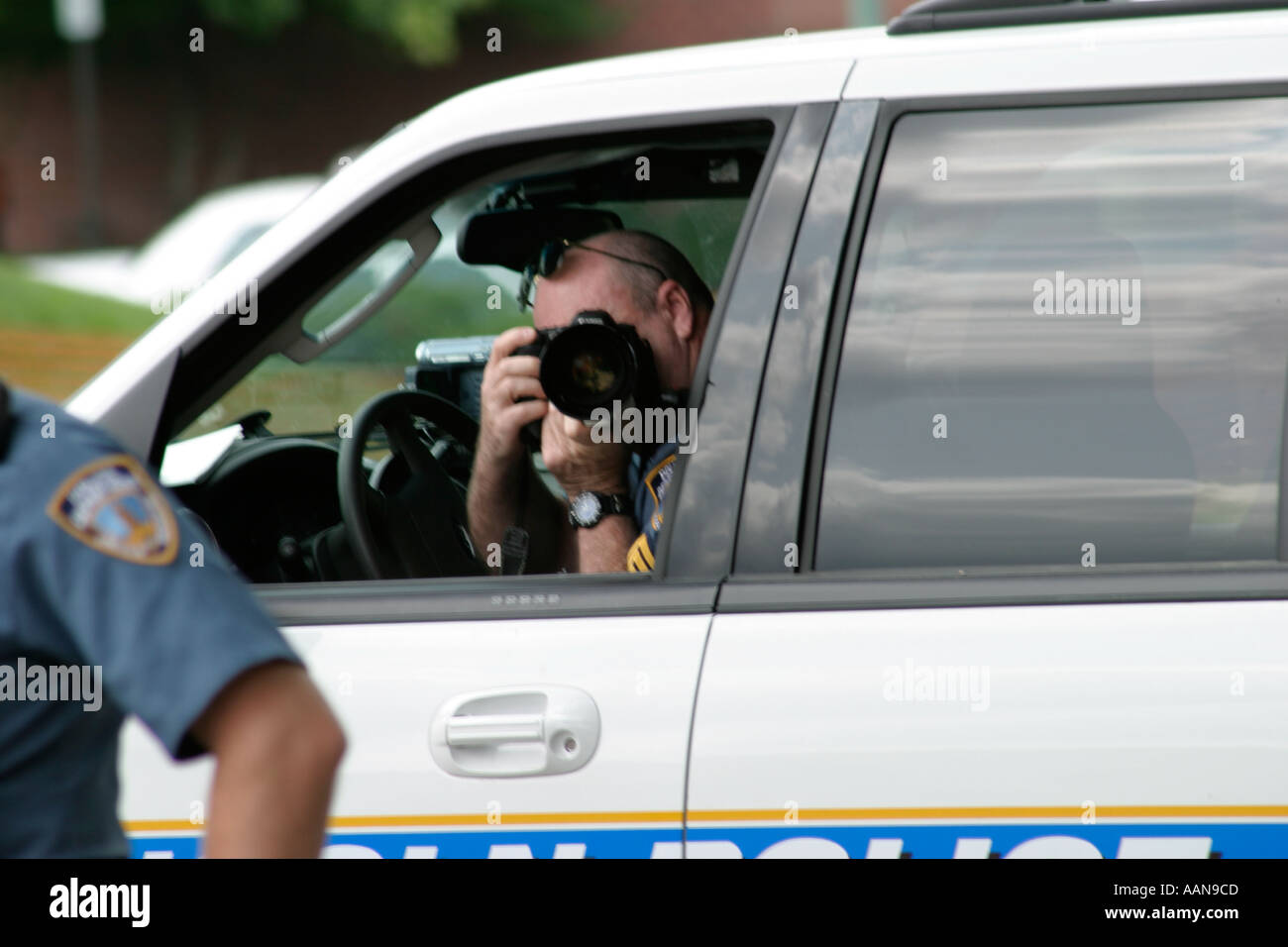 Funzionario di polizia a fotografare Foto Stock