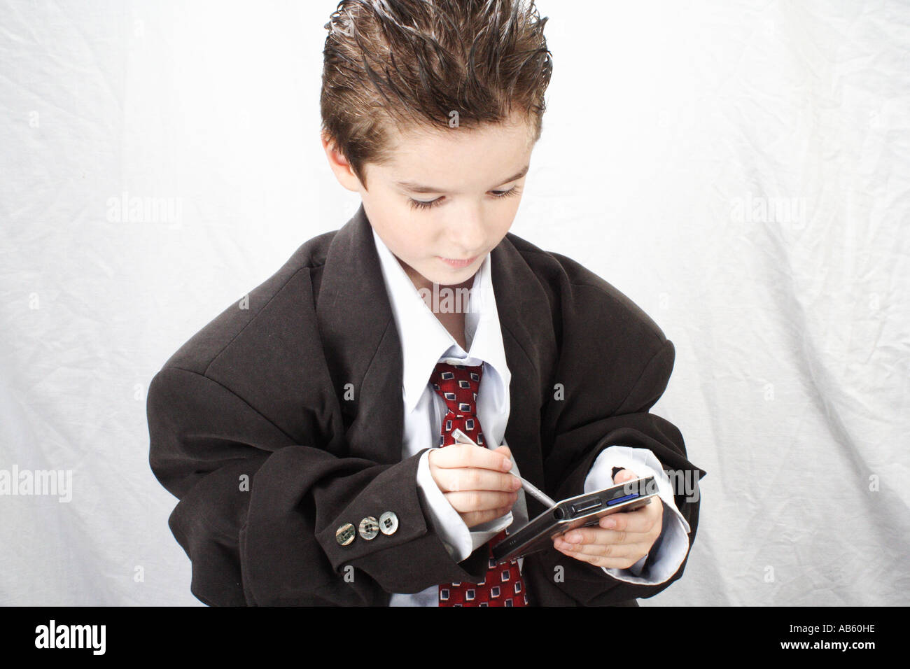 Po' Boy - Imprenditore. BusinessBoy lavora con il suo PDA. Foto Stock