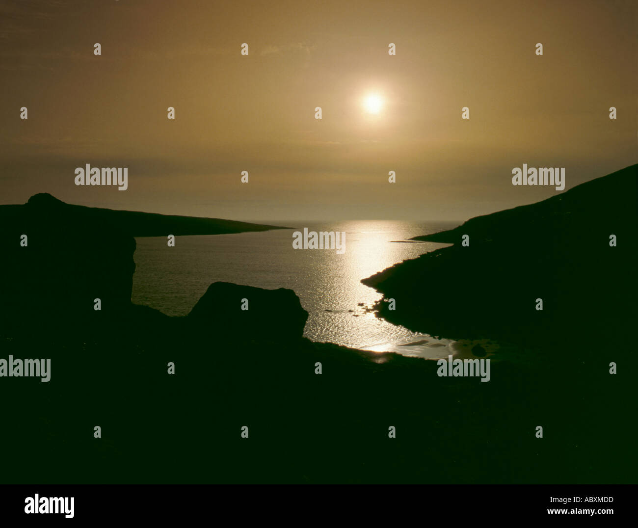 Isola tramonto, suono di Vatersay, Barra, Ebridi Esterne, Scotland, Regno Unito. Foto Stock