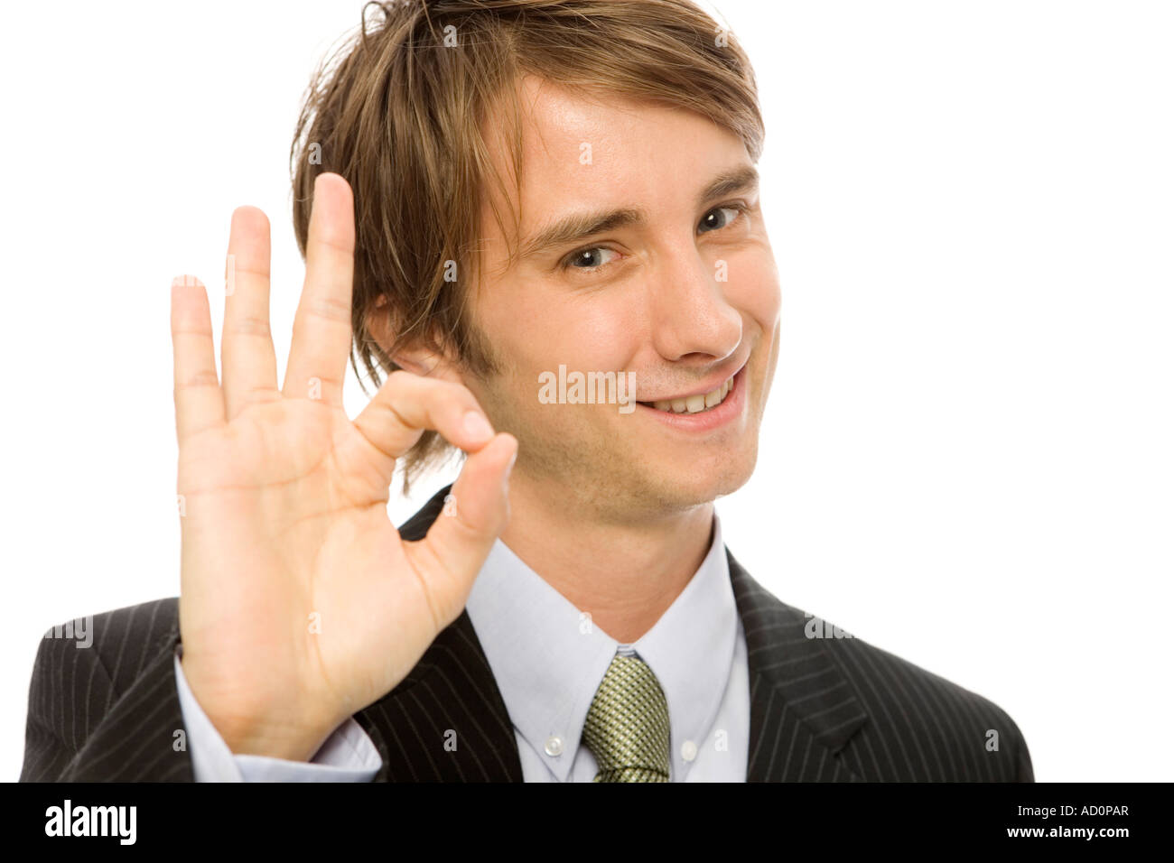 Imprenditore in un vestito di gesti ok con le sue dita Foto Stock