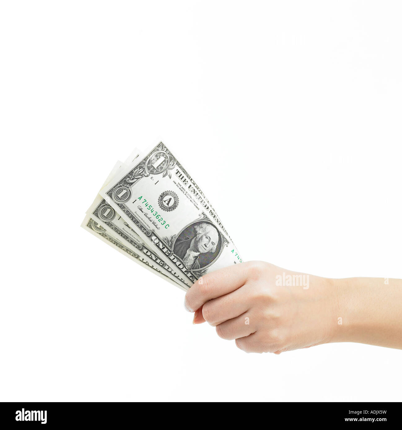 Una mano che tiene qualche carta moneta Foto Stock