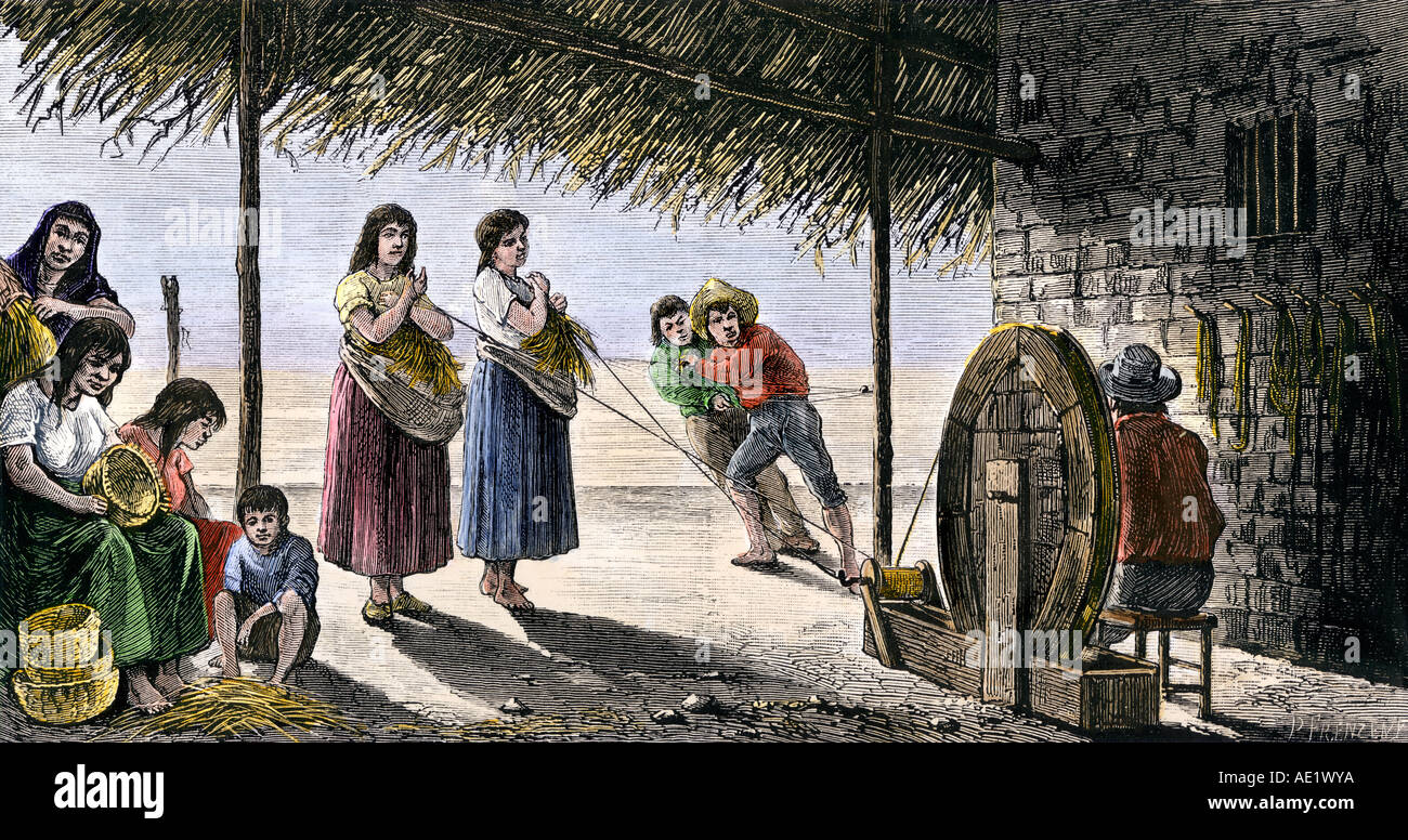 Gli Indiani di missione rendendo cesti e corde di capelli nella California meridionale 1800s. Colorate a mano la xilografia Foto Stock