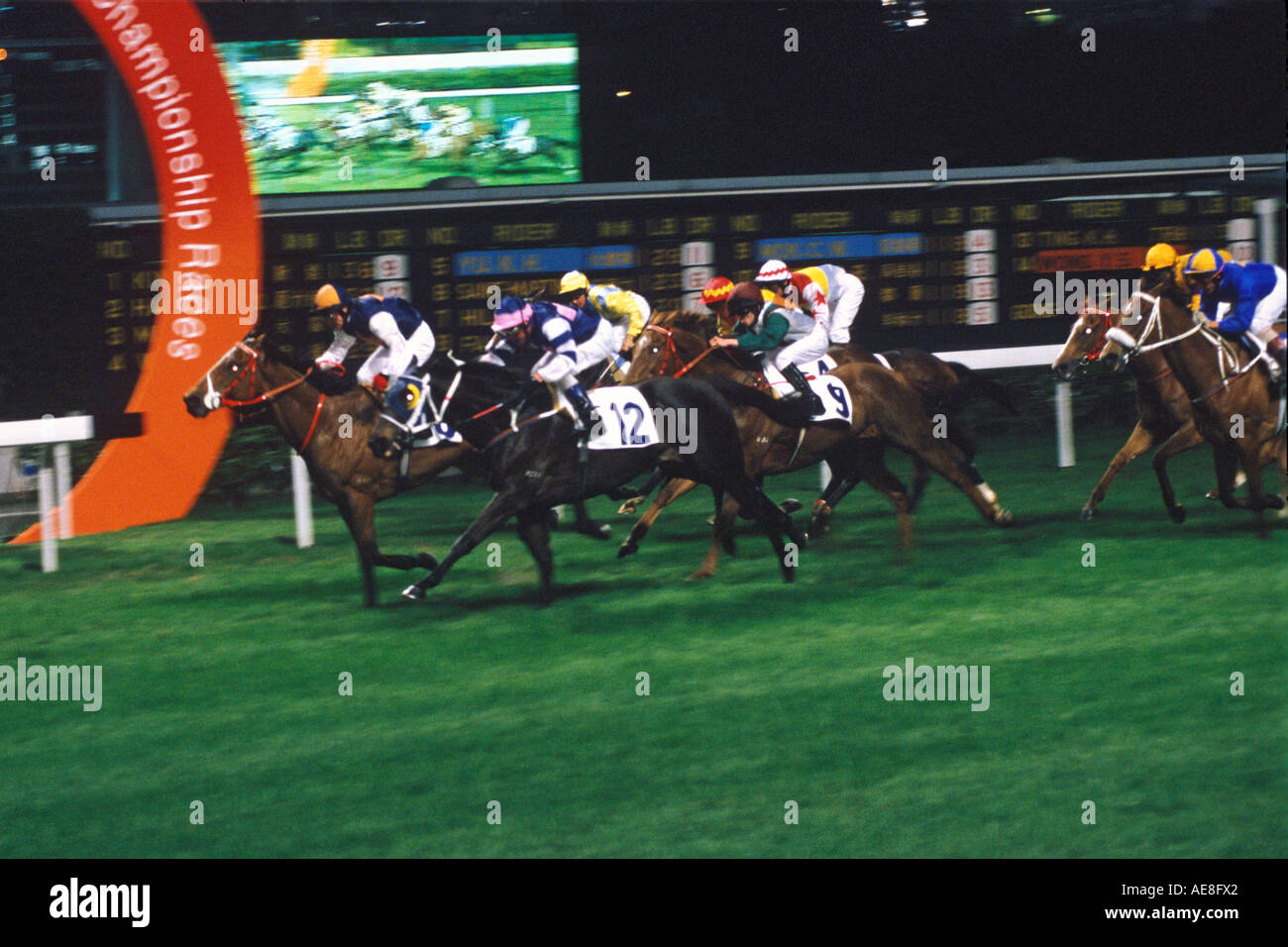 Corse di cavalli a Happy Valley Race via Hong Kong Foto Stock
