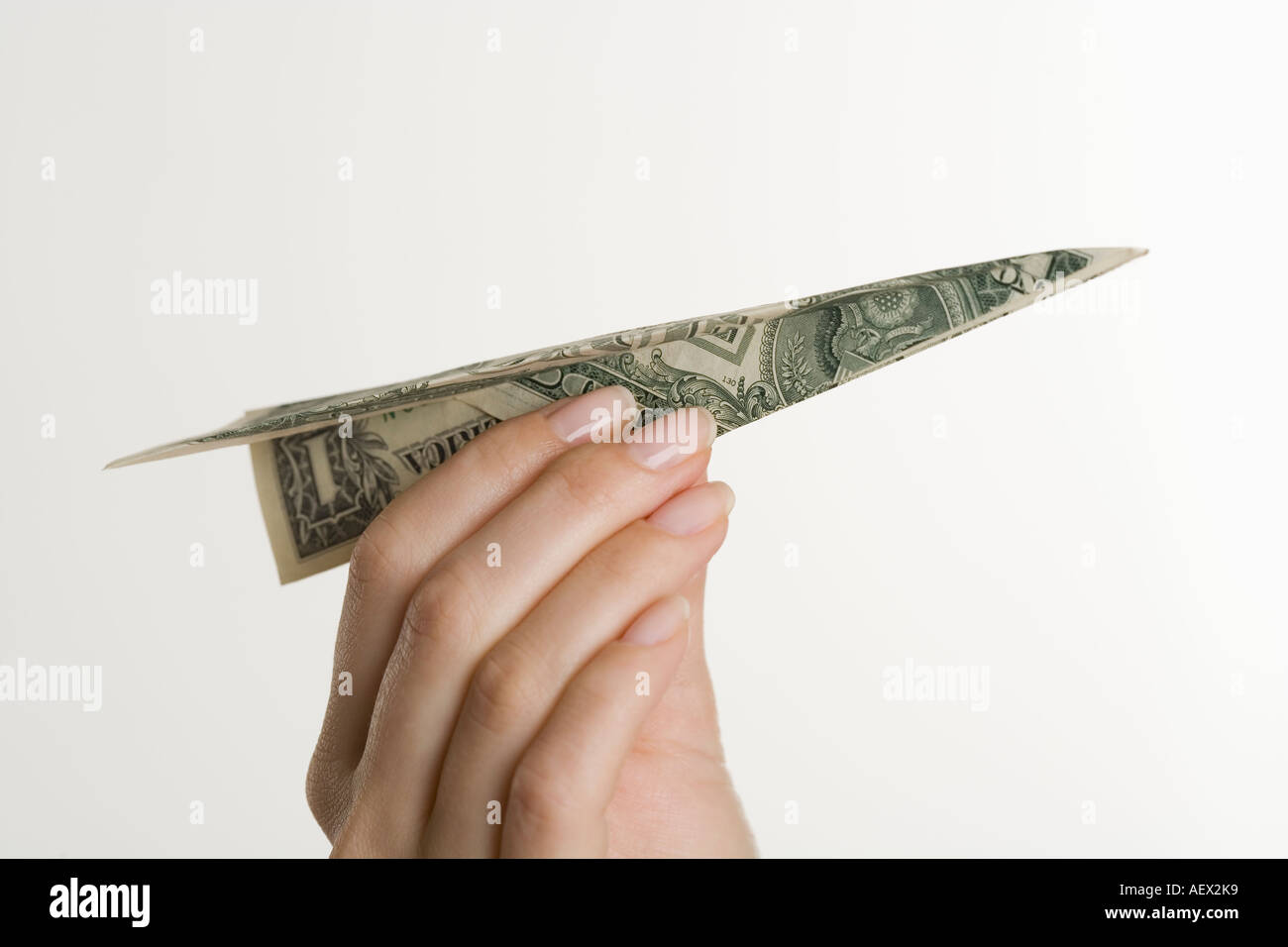 Aeroplano di carta fatta di denaro Foto Stock