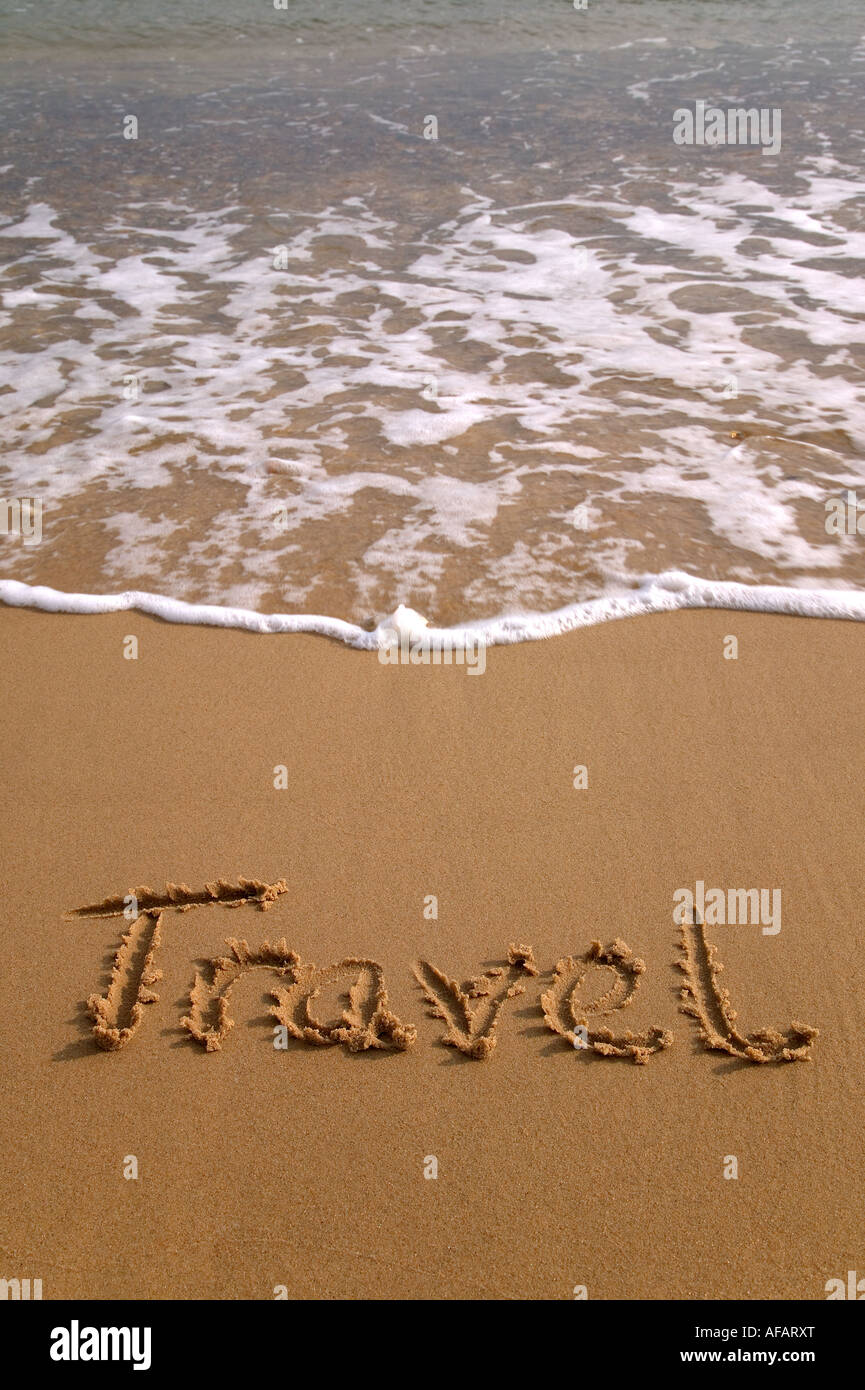 Scritto da viaggio di sabbia su una spiaggia Foto Stock