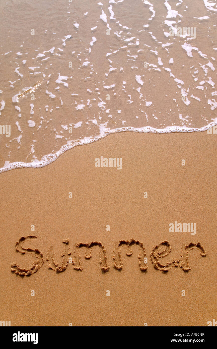 Estate scritto nella sabbia in spiaggia Foto Stock