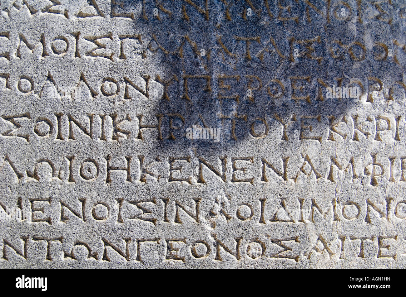 La scrittura greca in rovine sulla Delos, vicino a Mykonos, Grecia. Foto Stock