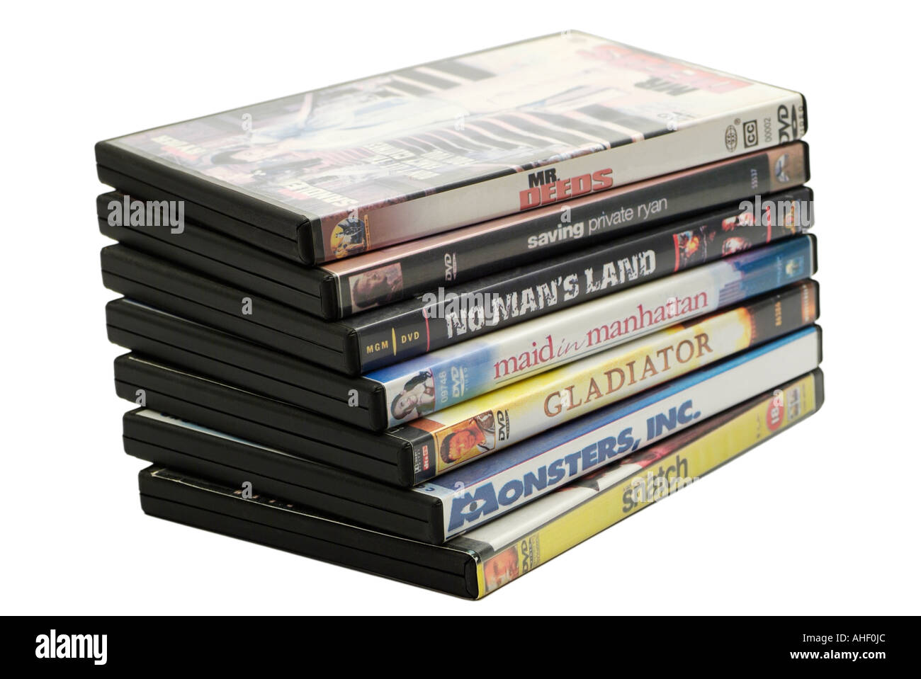 Pila di film in DVD su sfondo bianco Foto Stock