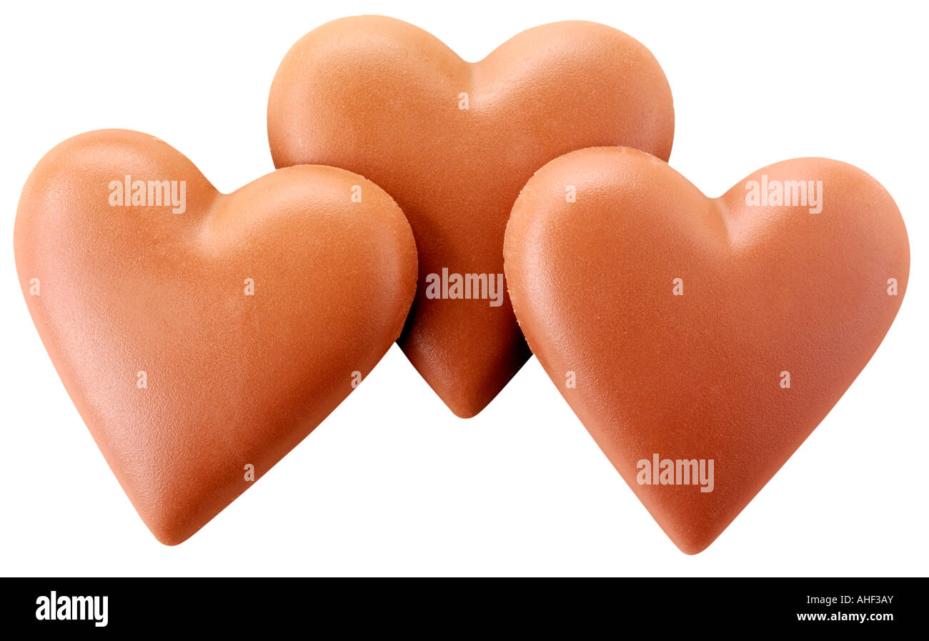 Tre cuori di cioccolato tagliati Foto Stock