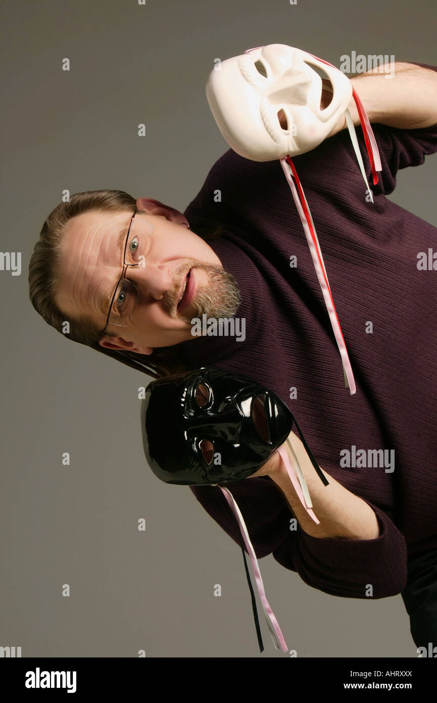 Uomo con felice e triste Foto Stock