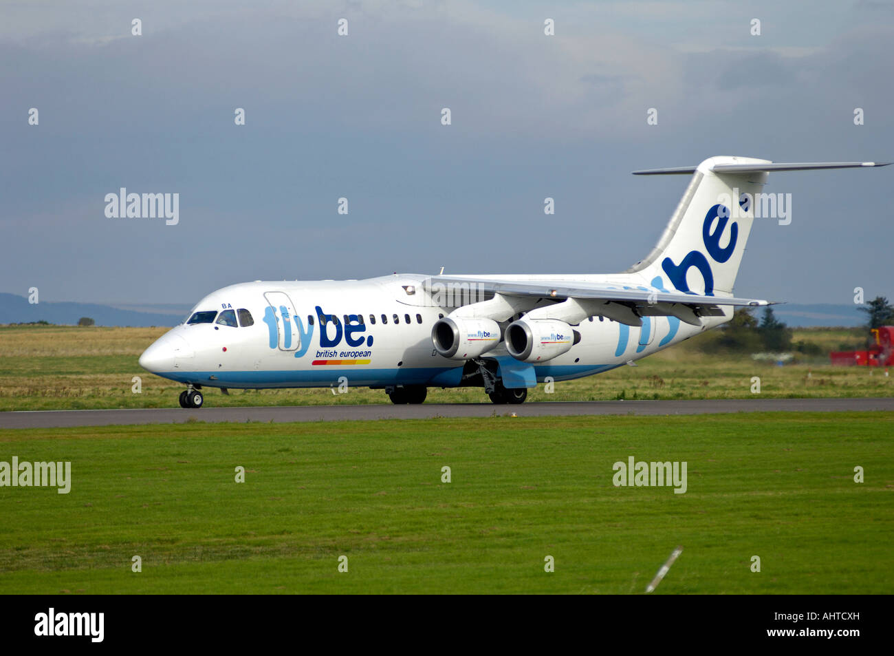 In base Exeter Flybe aeromobile- Europeo britannico British Aerospace BAe-146-300 sulla pista Taxi modo Foto Stock