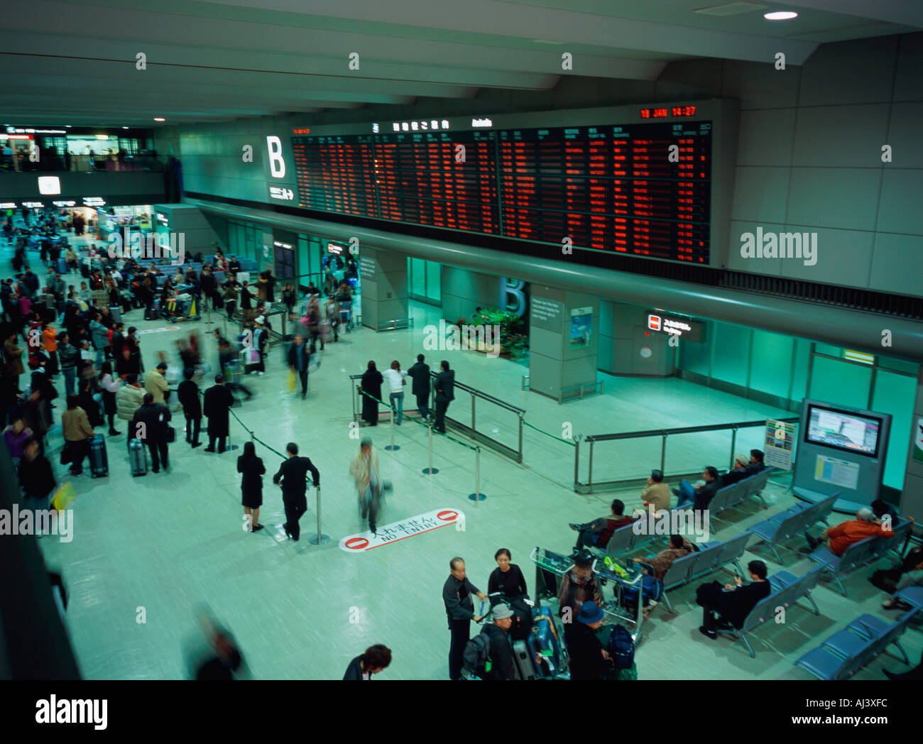 Occupato airport terminal movimento sfocato Foto Stock