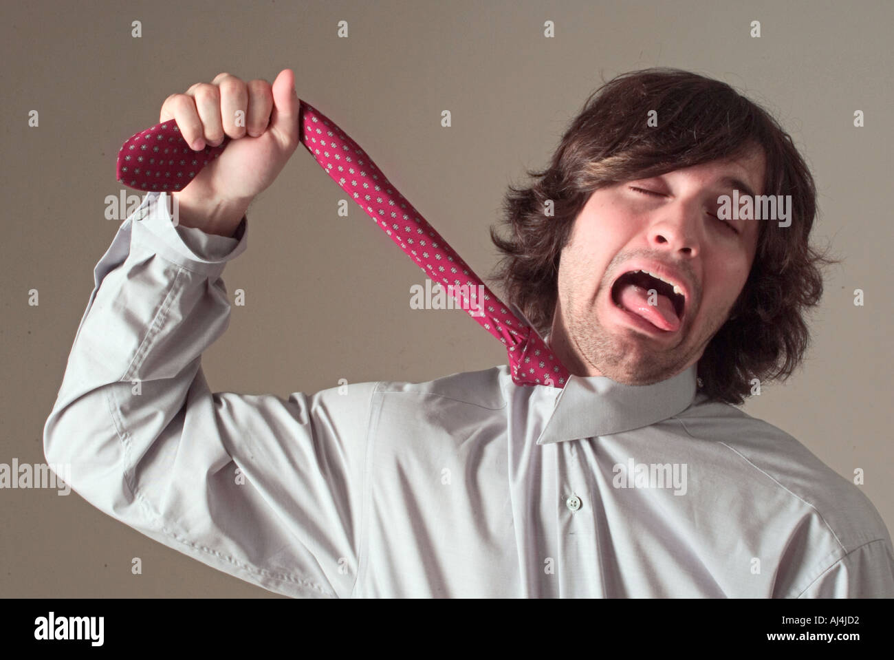 Giovane uomo infelice con il lavoro di ufficio Foto Stock