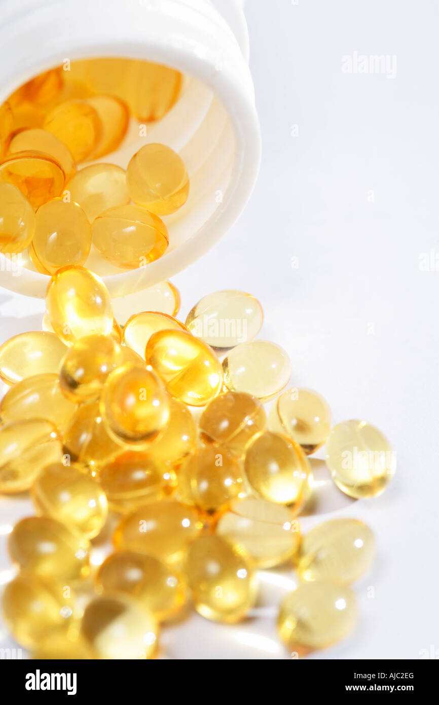 Eventuali fuoriuscite di Bottiglia di Vitamens giallo Foto Stock