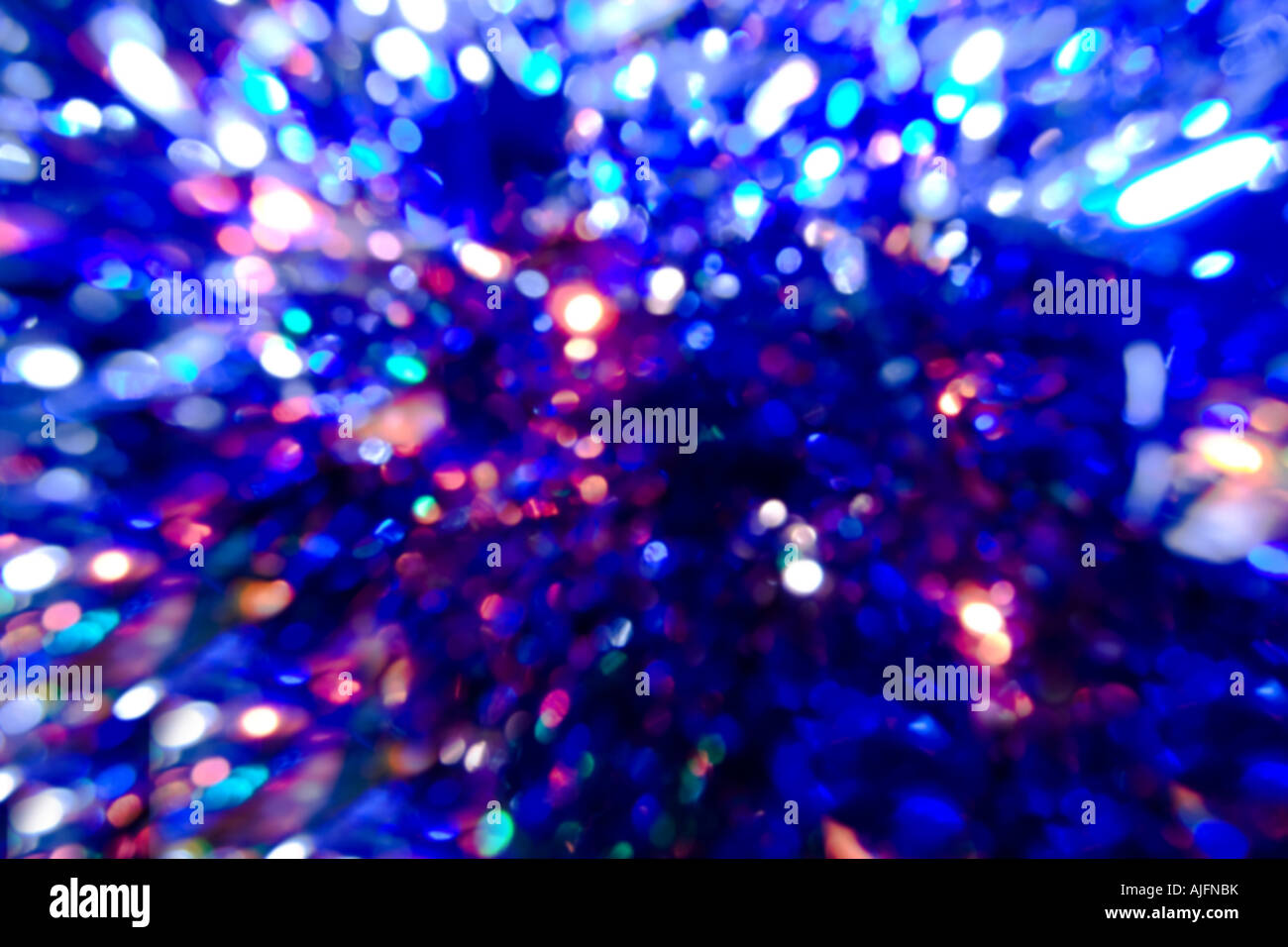 Luminose festosa sfocata e luci colorate sullo sfondo Foto Stock