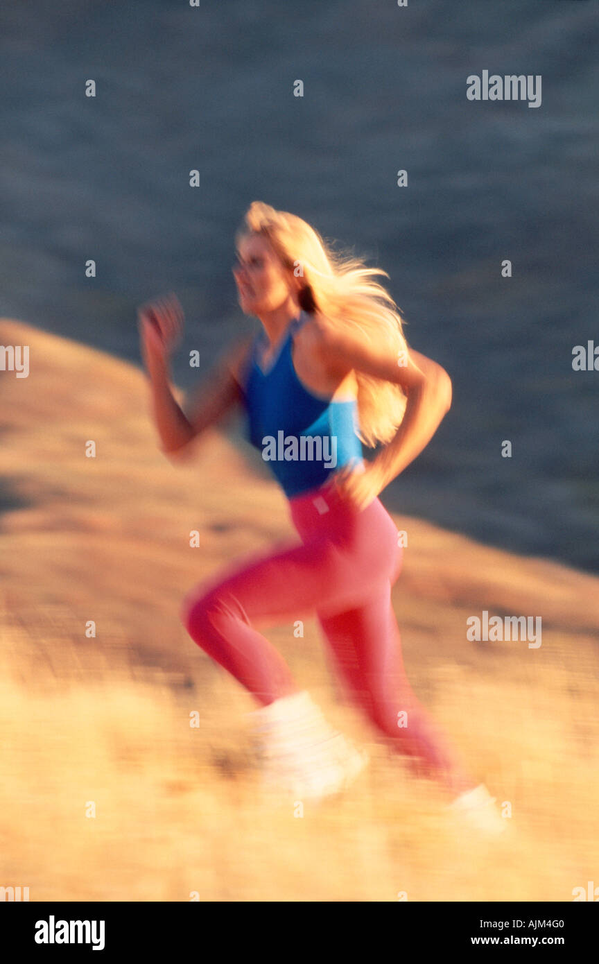 Donna sfocata runner Foto Stock Donna sfocata runner Foto Stock