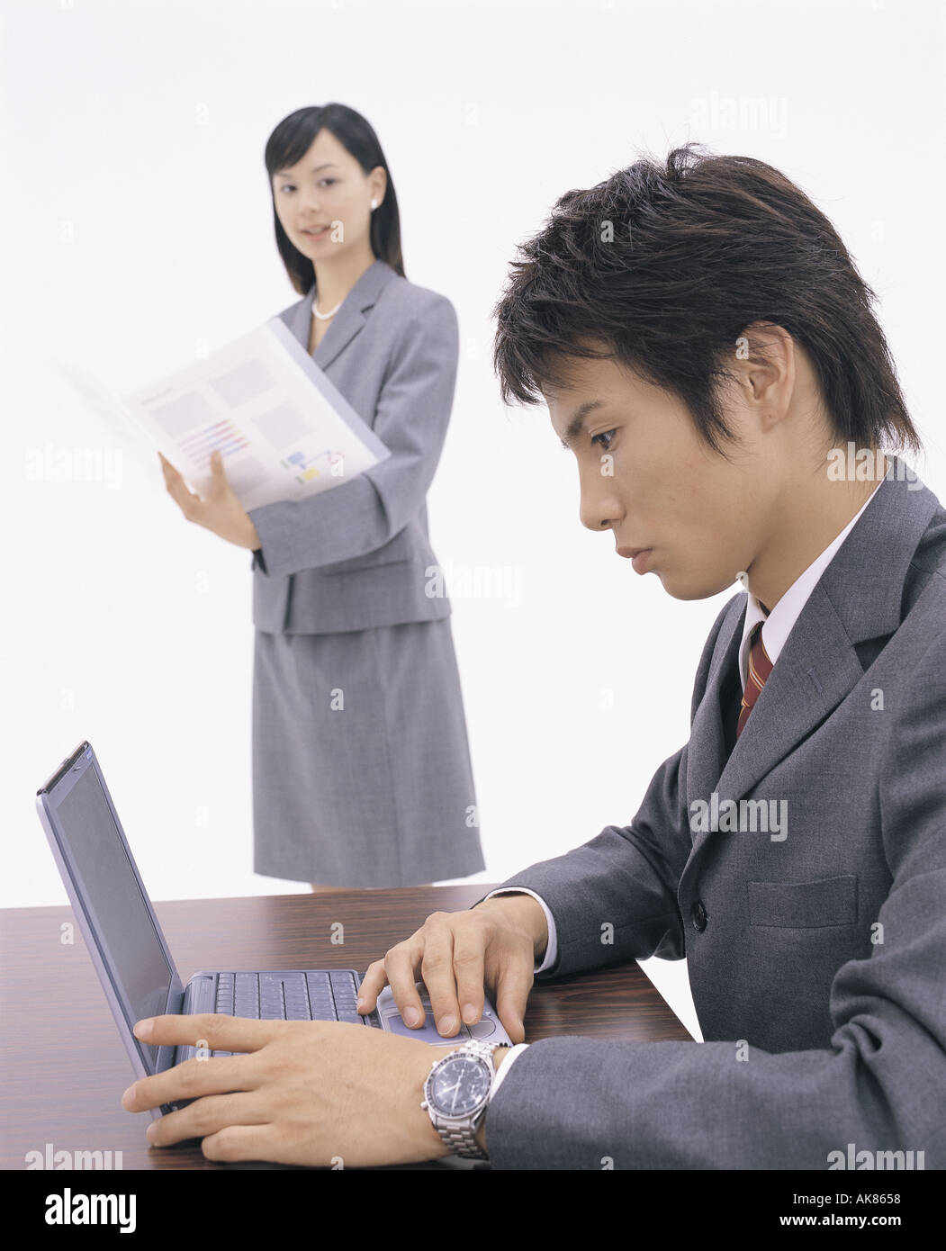 La gente di affari con computer portatile Foto Stock