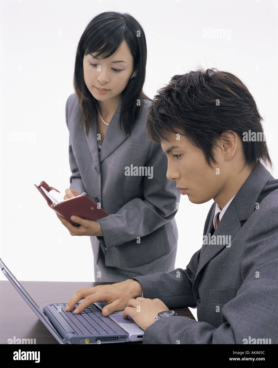 La gente di affari con computer portatile Foto Stock