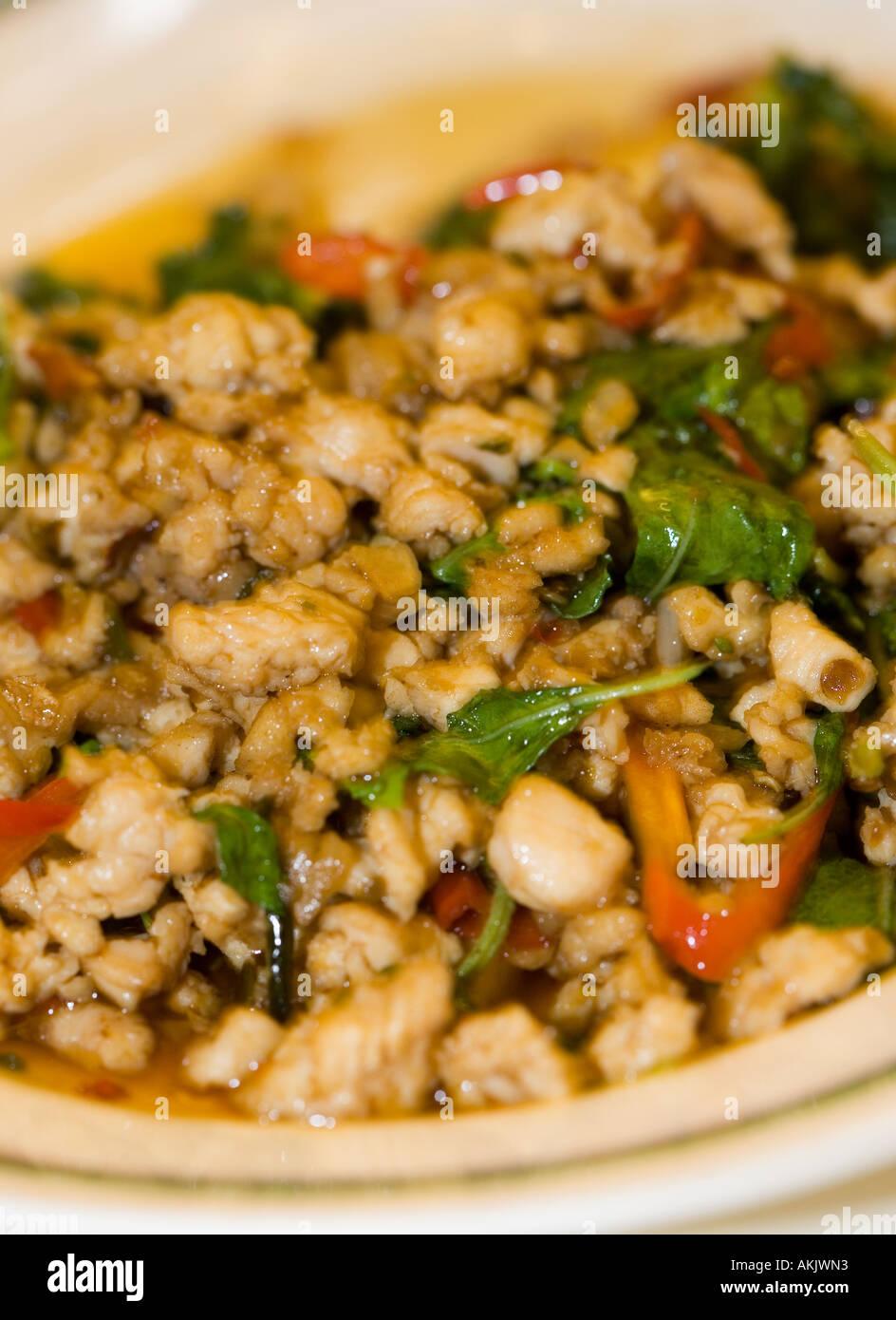 Stir-Fried Chicken con basilico Foto Stock