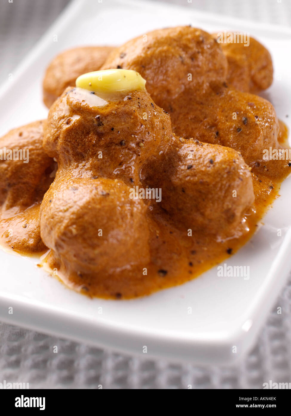 Un piatto di indiani Dum, Aloo patate speziate vegetariano cibo editoriale Foto Stock