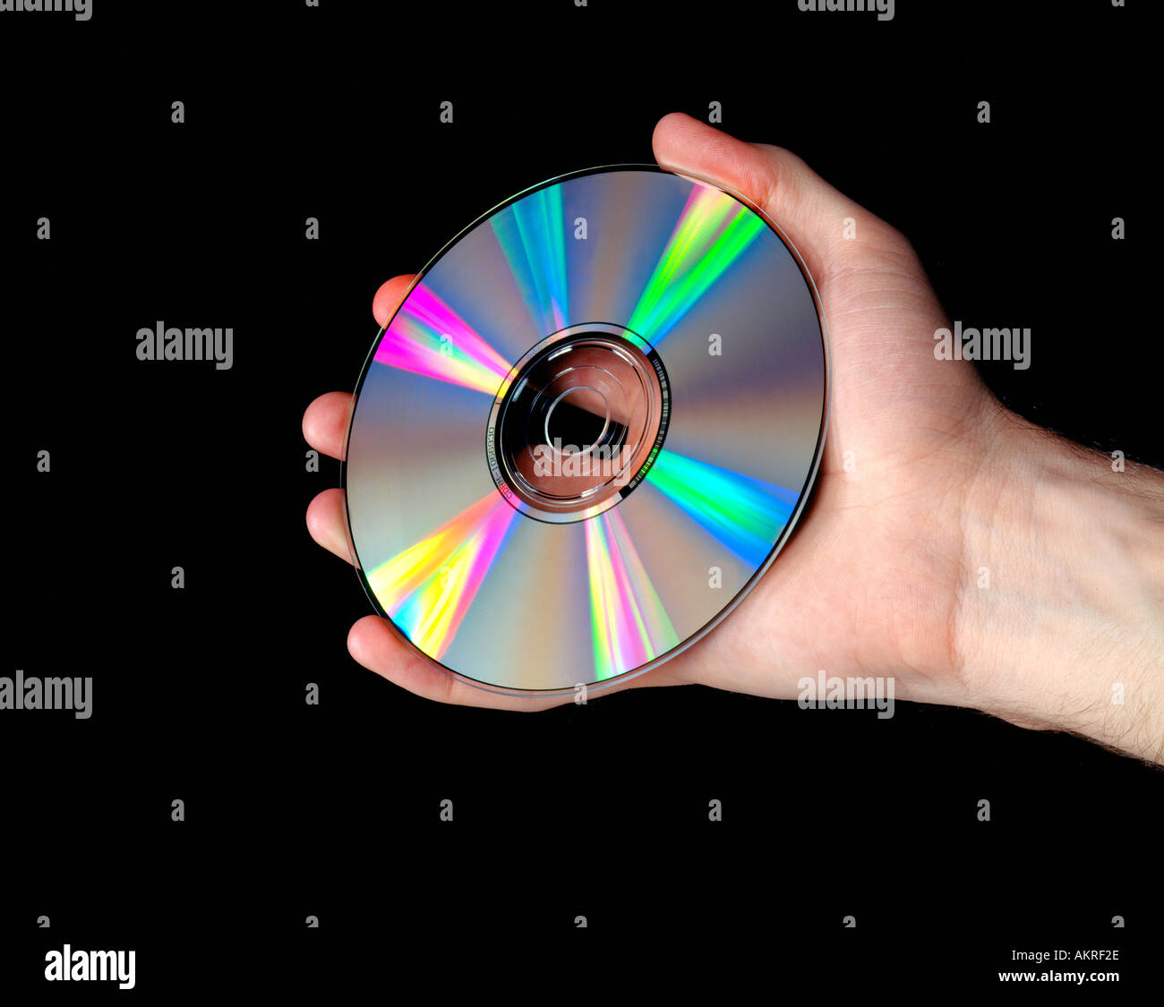 Mano che tiene il cd-rom Foto Stock