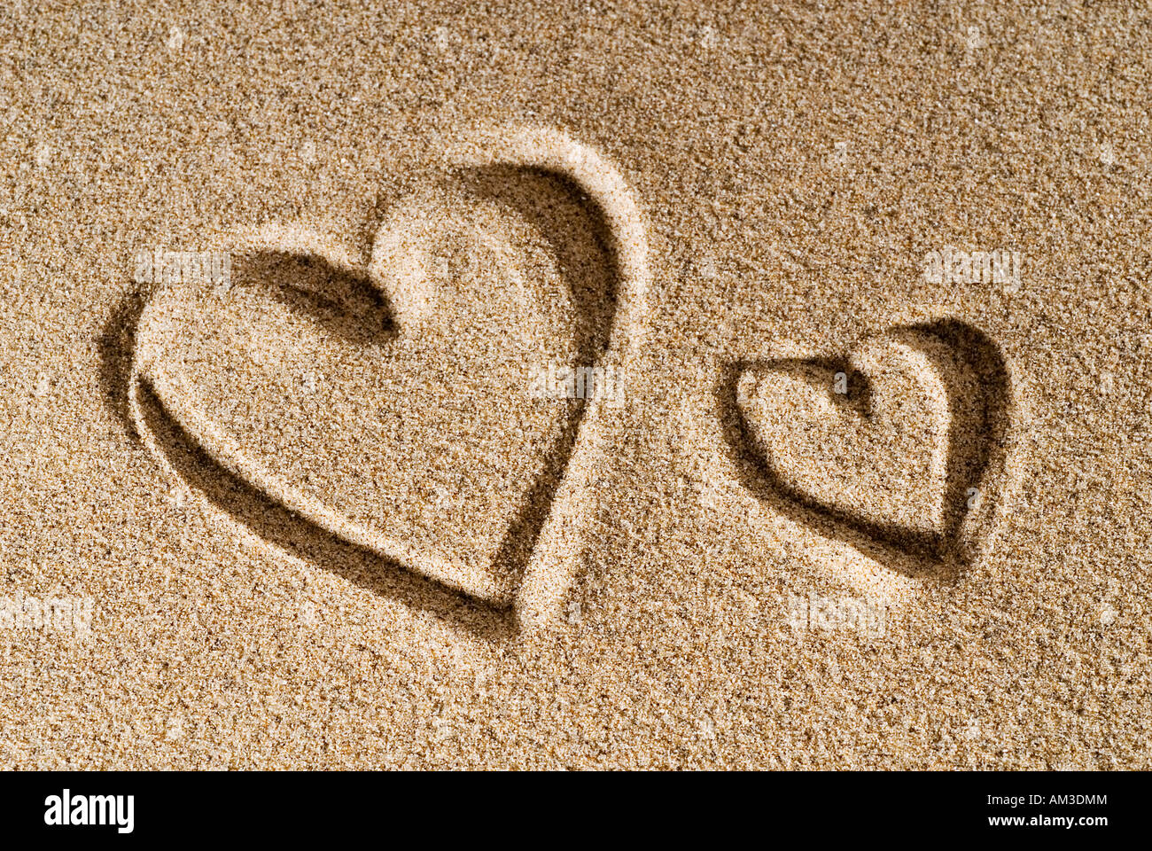 Un cuore dipinto nella sabbia Foto Stock