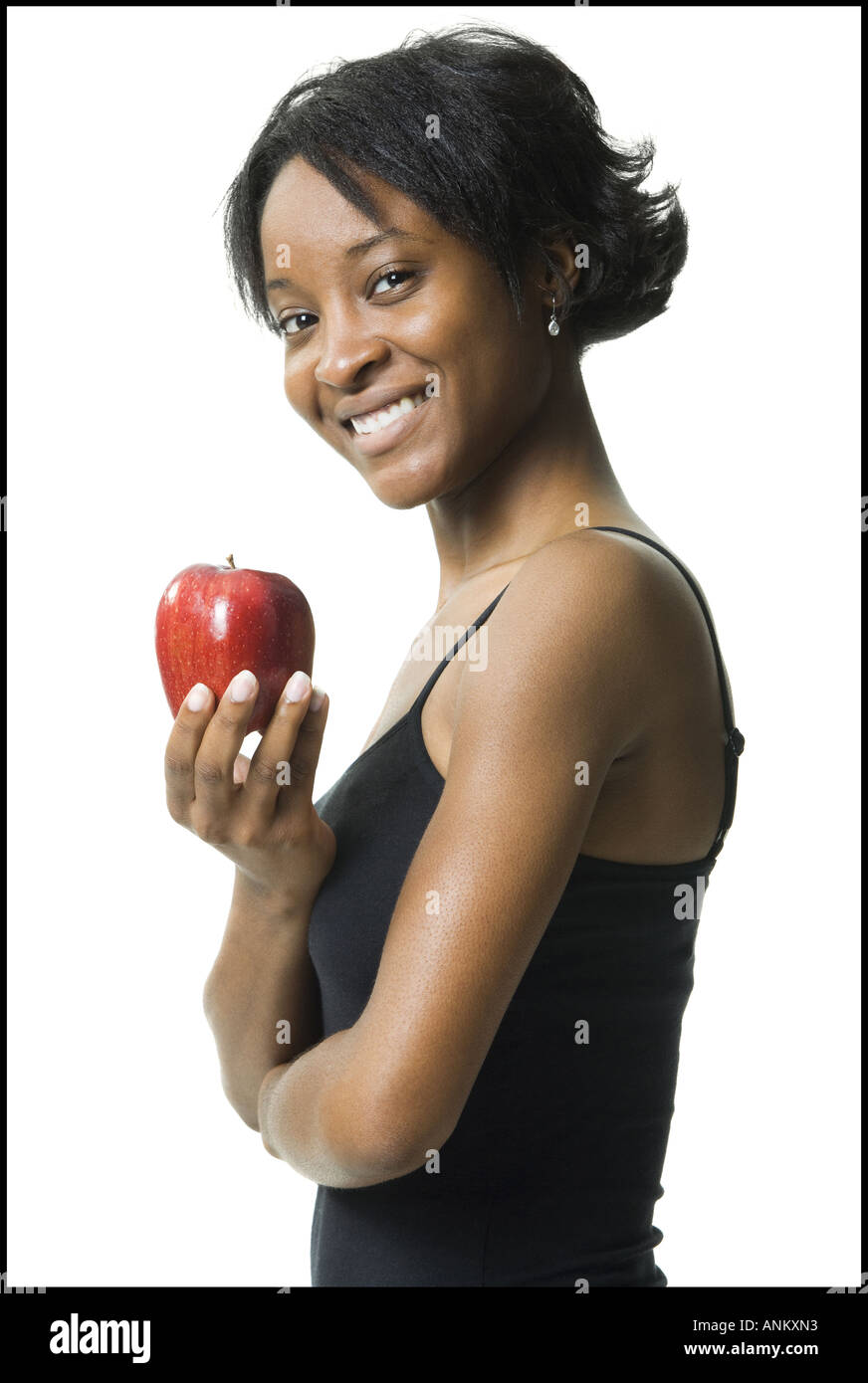 Profilo di una giovane donna in possesso di un Apple Foto Stock