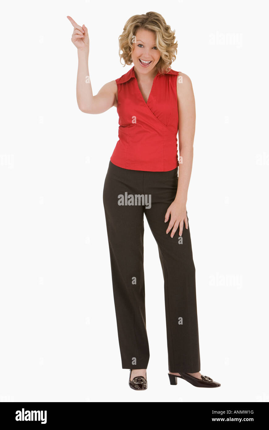 Donna puntare il dito in aria Foto Stock