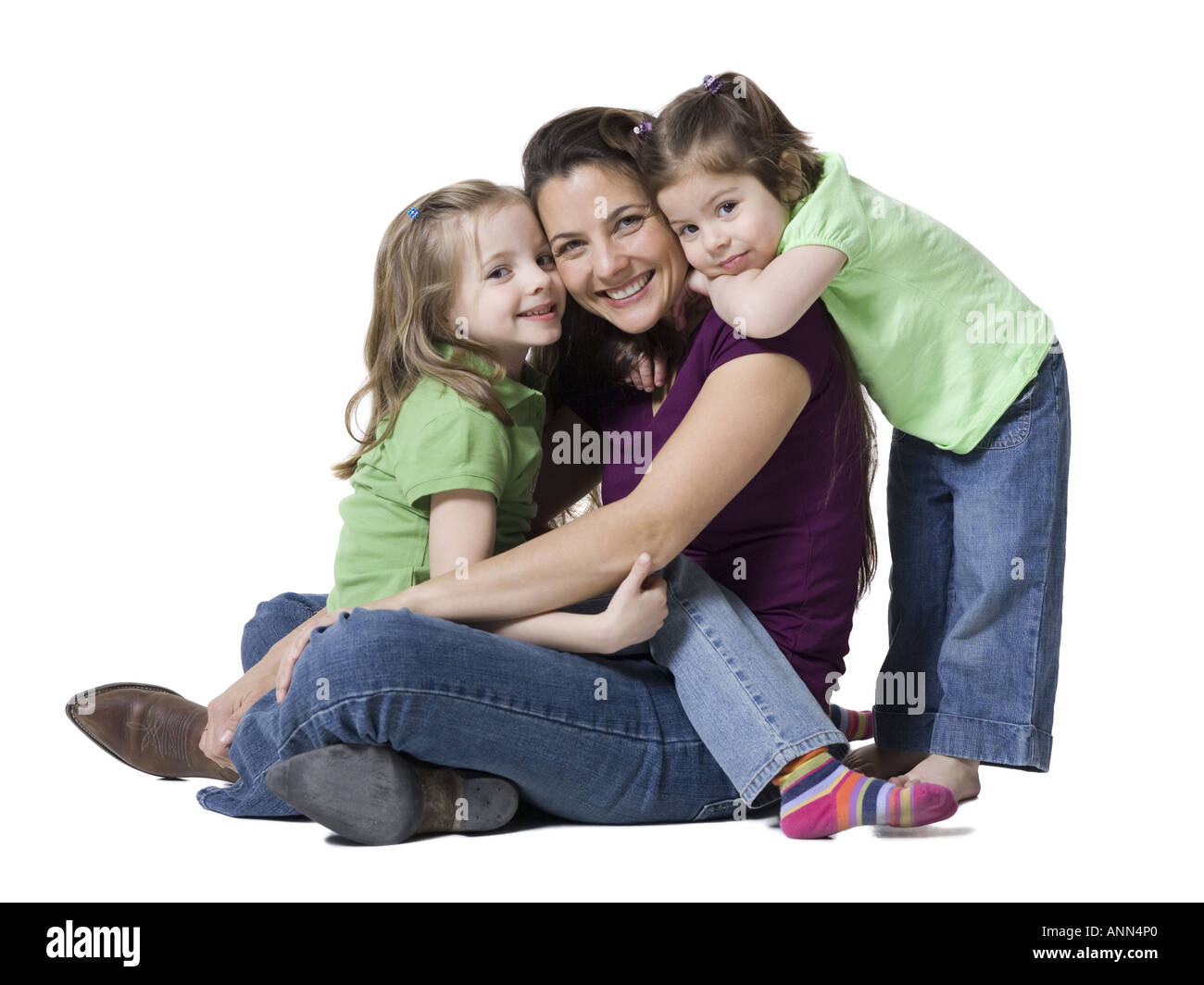 Ritratto di una donna e le sue due figlie sorridente Foto Stock