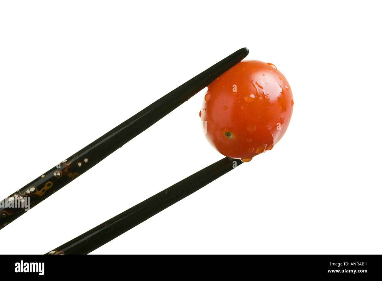 Uva pomodoro tenuto con nero bacchette intarsiato Foto Stock