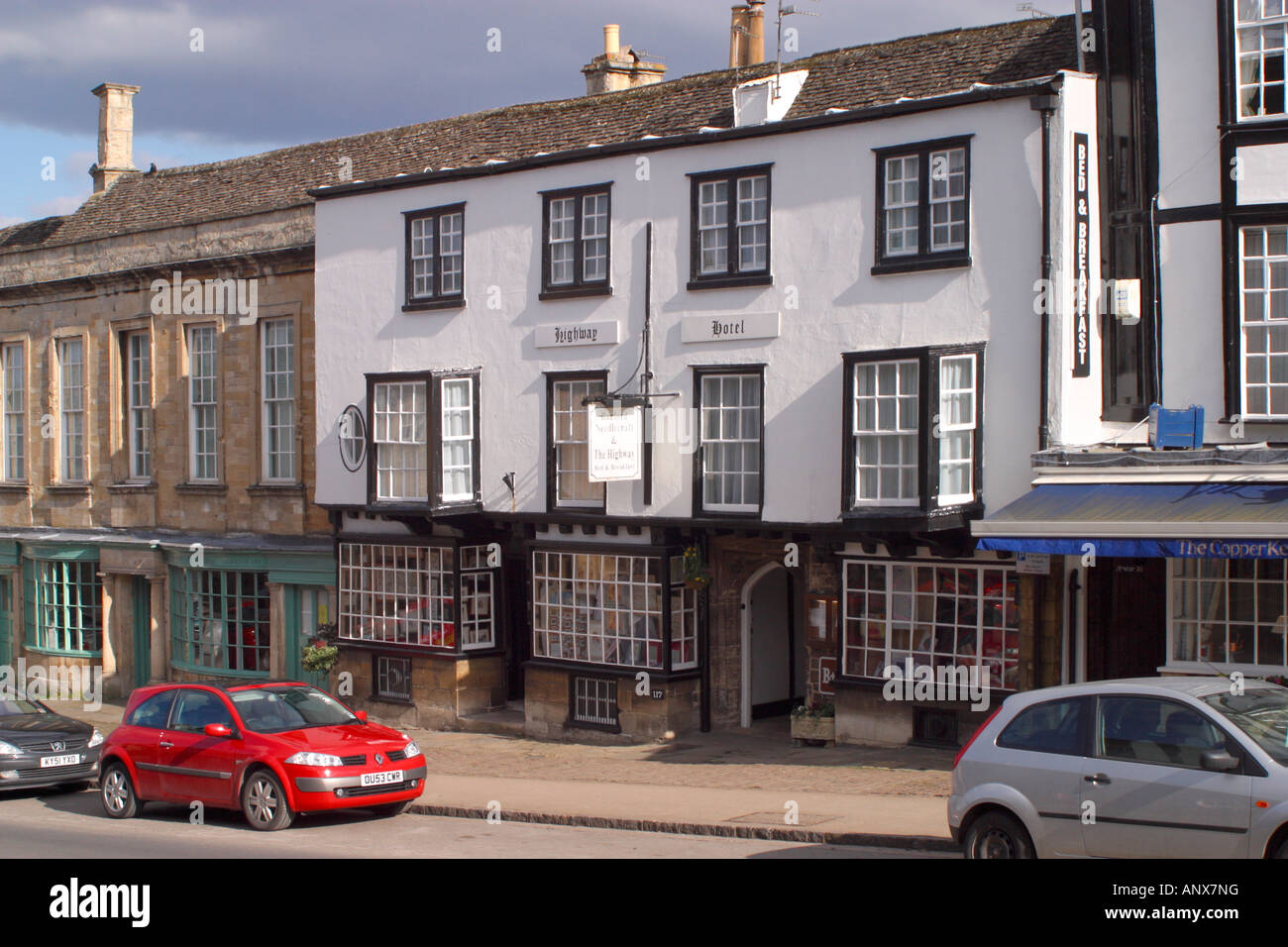 Storico negozio fronti sulla Strada Alta, burford, Oxfordshire, Cotswolds, England, Regno Unito Foto Stock