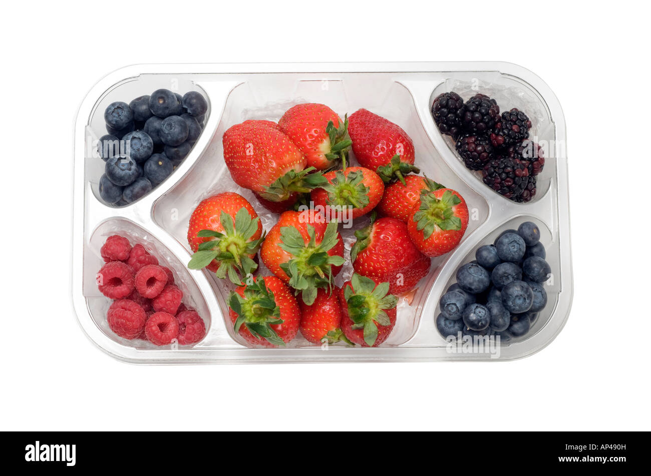 Frutti misti in un chiaro vassoio di plastica Foto Stock