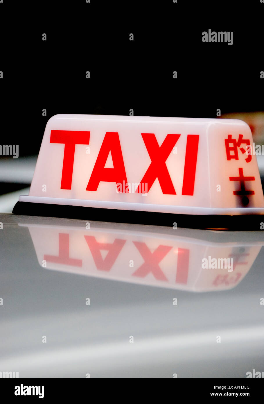 'Taxi segno su un Hong Kong taxi tetto' Foto Stock