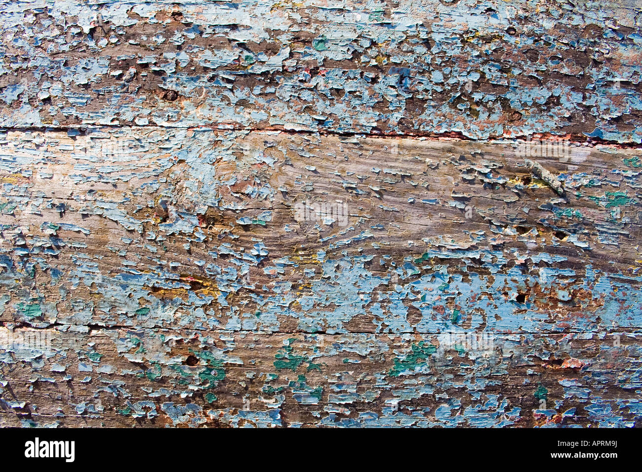 Vernice pelata su pannelli di legno da lo scafo di una barca Foto Stock