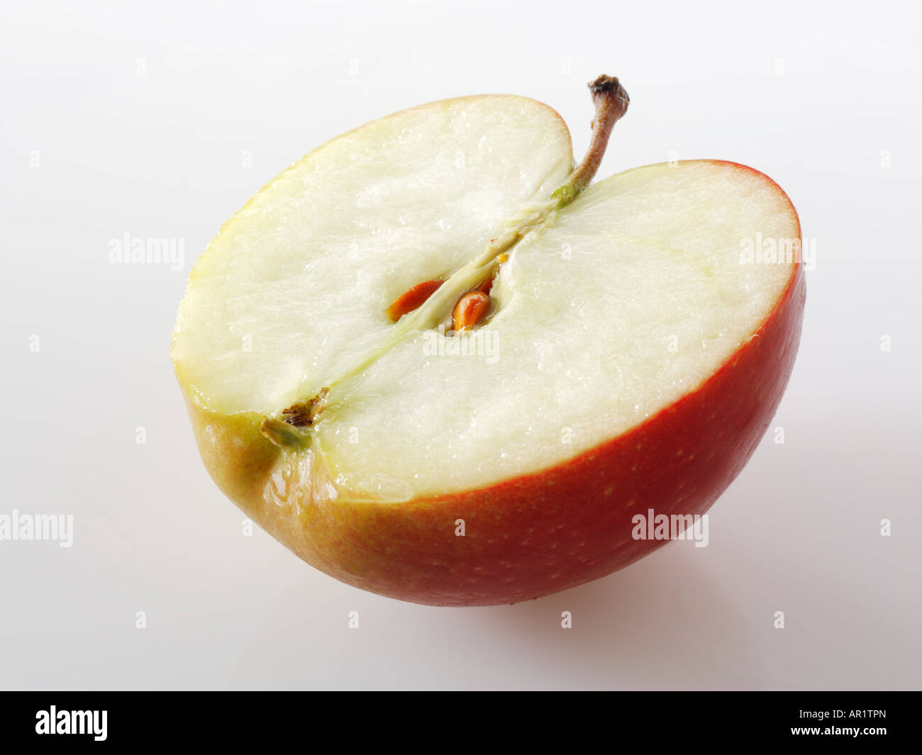 Mezza mela con i vinaccioli - Braeburn Foto Stock