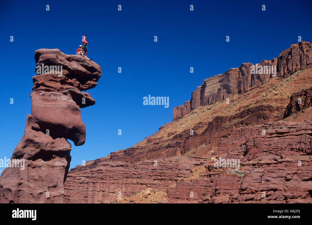 Arrampicatori presso Fisher torri nei pressi di Moab Utah Foto Stock