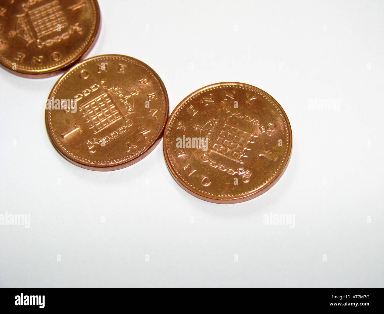 Tre un penny monete Foto Stock