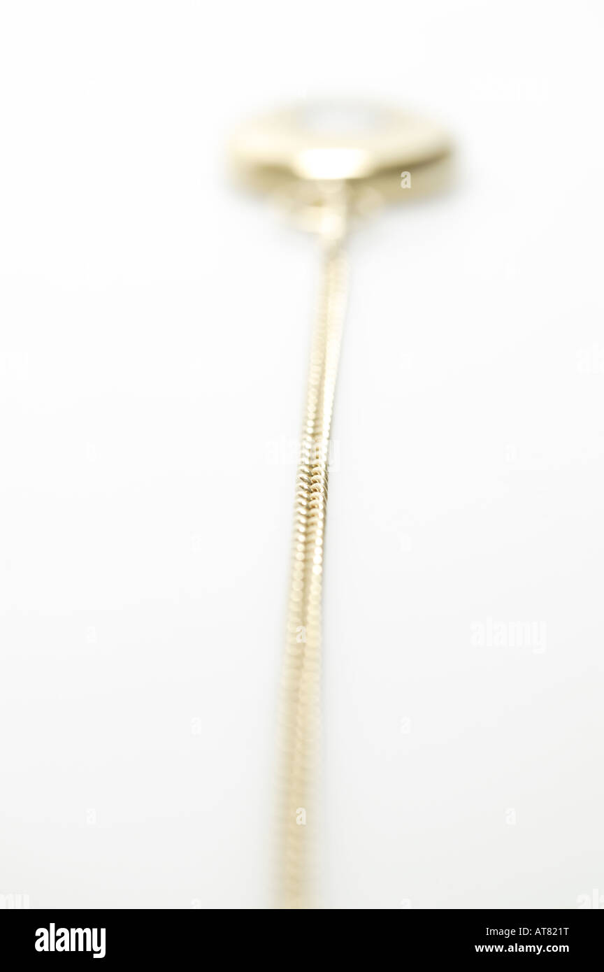 Vista astratta di oro orologio da tasca a catena, Foto Stock