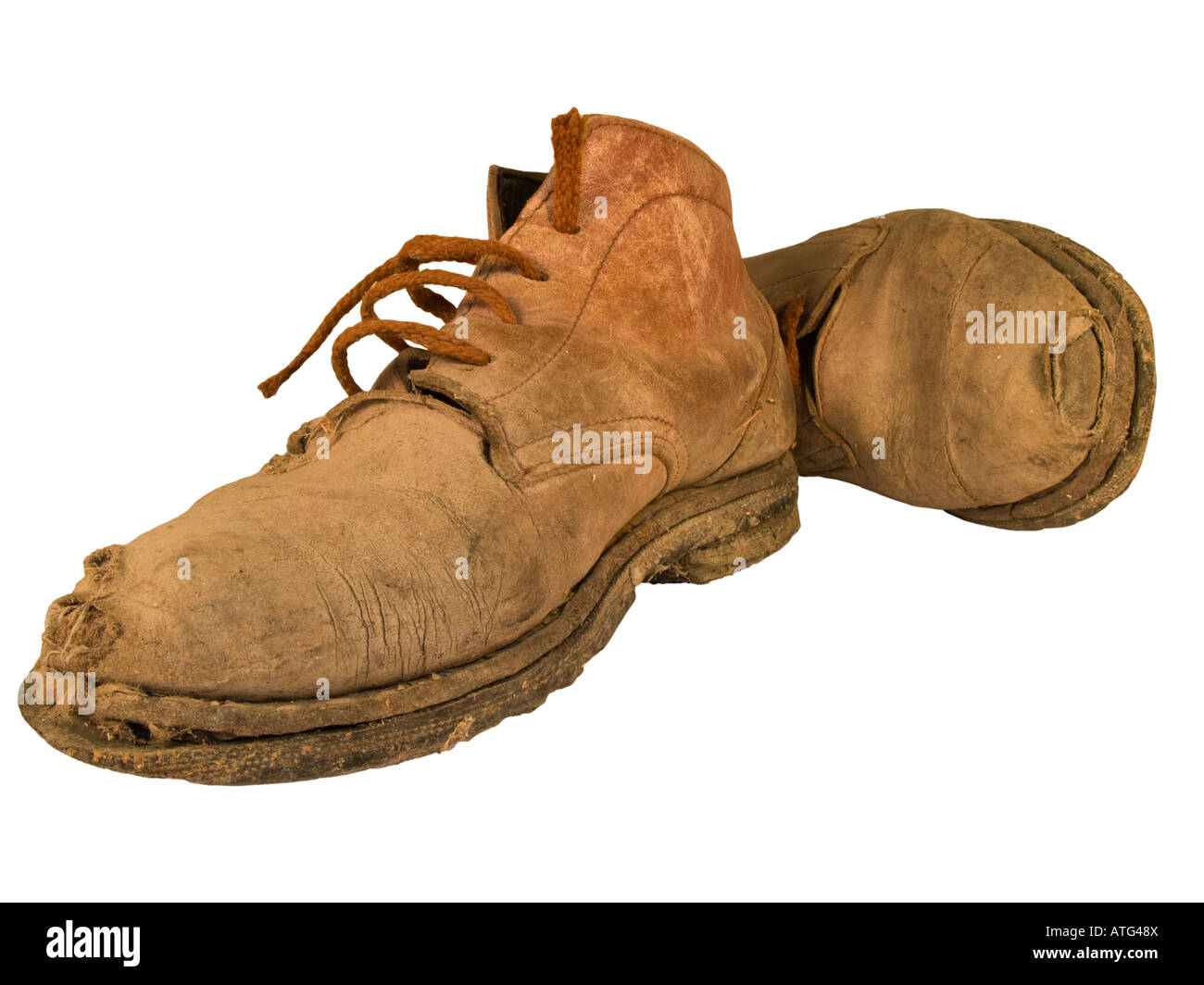 Vecchi e consunti stivali da lavoro con fori Foto Stock