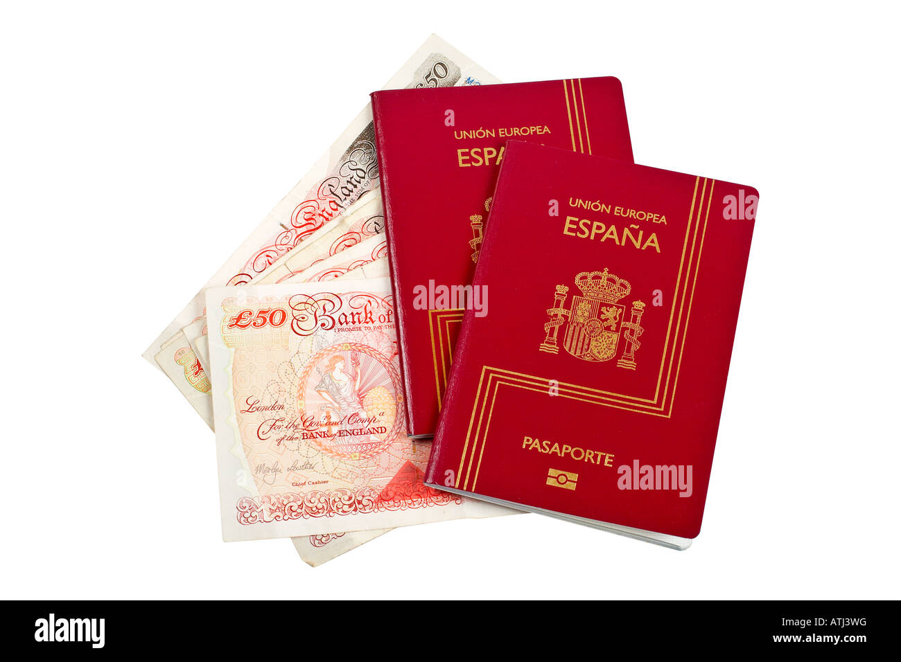 Spagna due passaporti e denaro isolato su sfondo bianco con percorso di clipping incluso Foto Stock