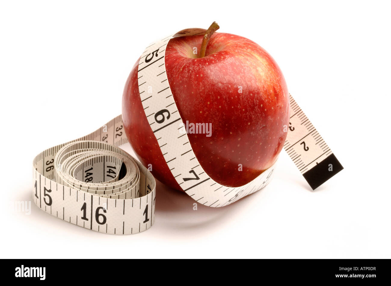 Red apple e nastro di misurazione Foto Stock