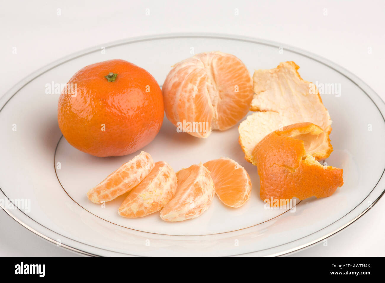 Segmenti di mandarino / Clementine frutta arancione Foto Stock