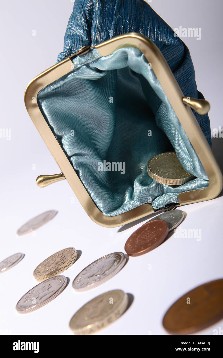 Borsa vuota monete denaro contante e un portamonete aperto Foto Stock