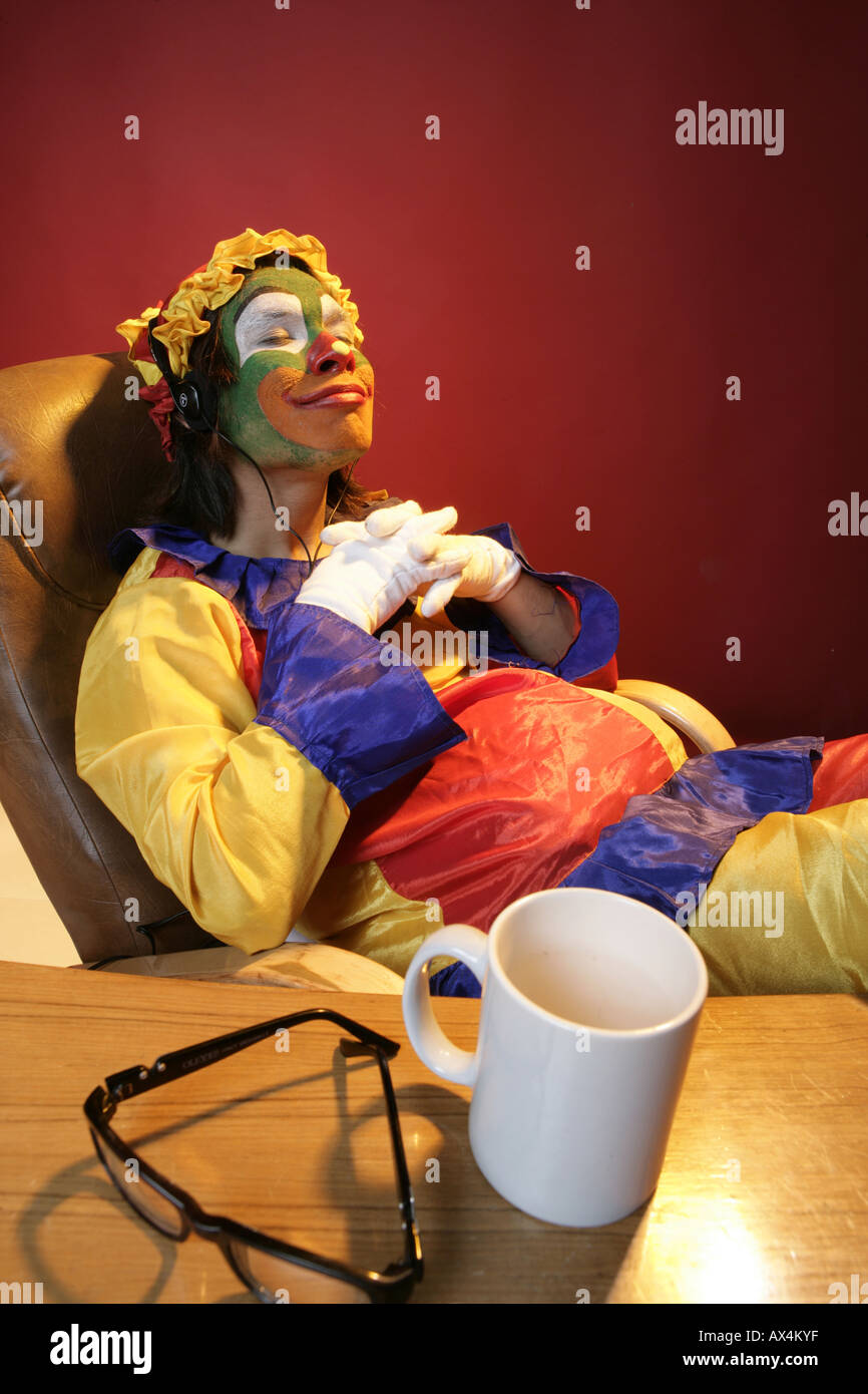 Joker seduti su una sedia e sognare Foto Stock