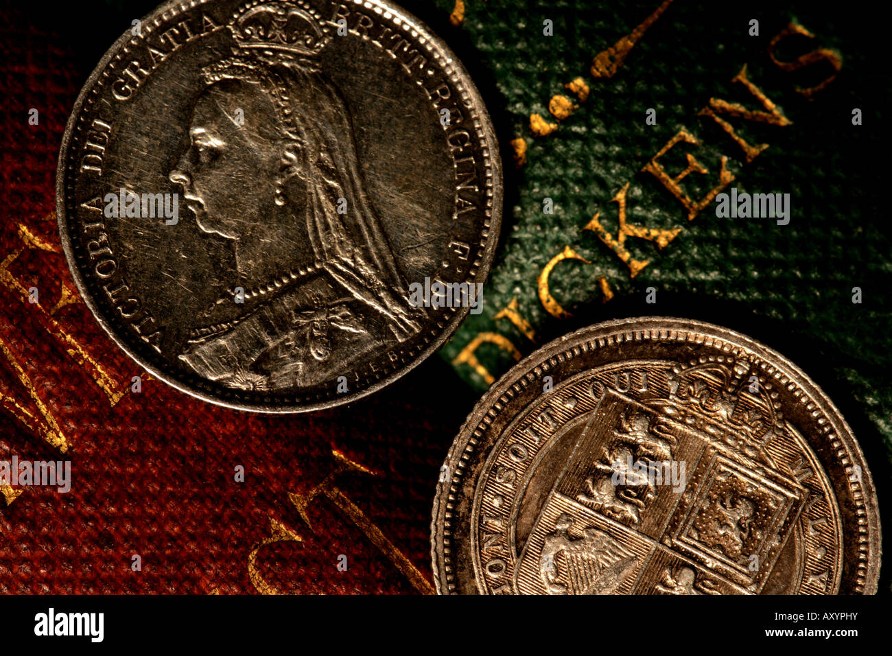 'Libro e moneta' Foto Stock