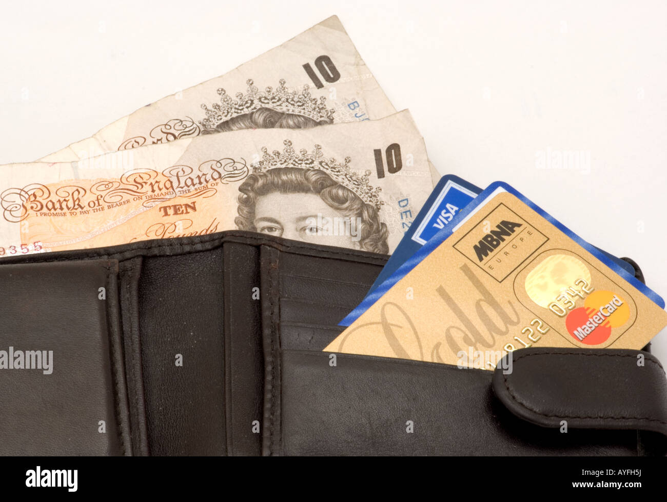 Il denaro di carte di credito in un portafoglio Foto Stock