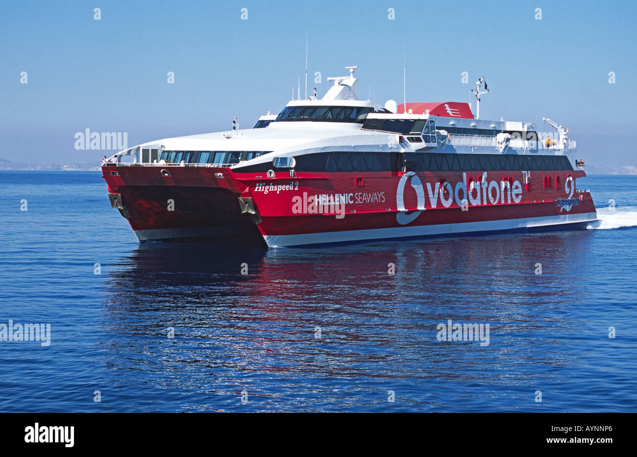 La Hellenic Seaways catamarano veloce traghetto Highspeed 2 arriva a Tinos in greco isole dell' Egeo Foto Stock