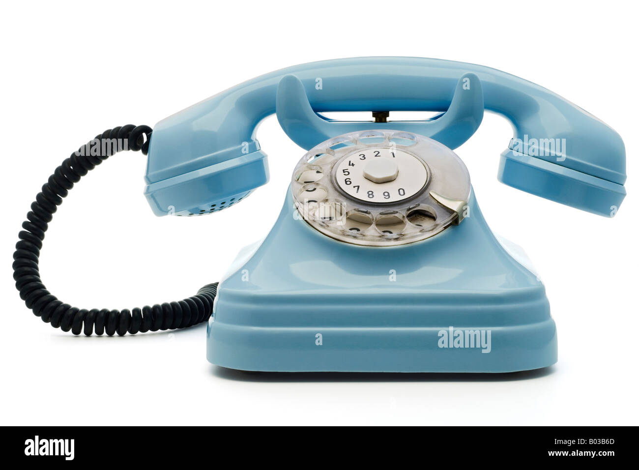 Un vecchio telefono blu su bianco - con tracciato di ritaglio Foto Stock